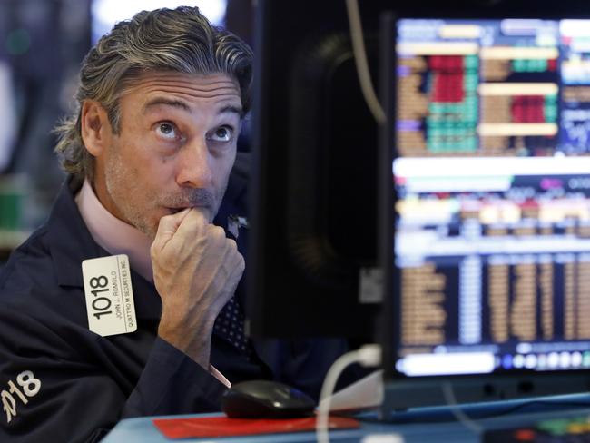 Trader John Romolo on the floor of the New York Stock Exchange as the market dropped 3 per cent. Picture: AP