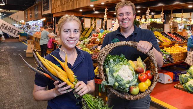 Shop assistant Emma Jordan and House of Organics owner Bill Howison with fresh fruit and veg at the Adelaide Central Market on Friday. Photo: Brenton Edwards