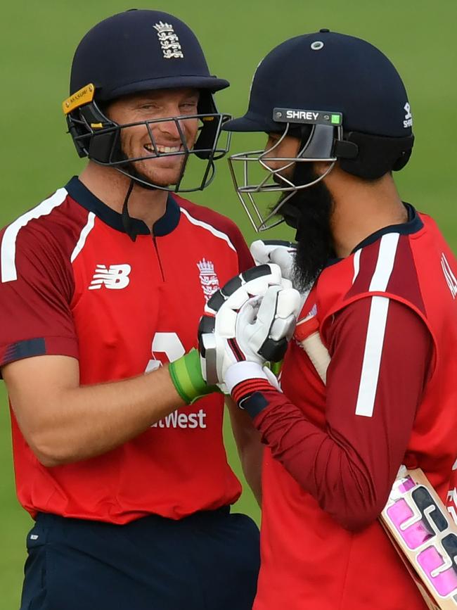 Jos Buttler and Moeen Ali celebrate England’s win. Picture: AFP Photo