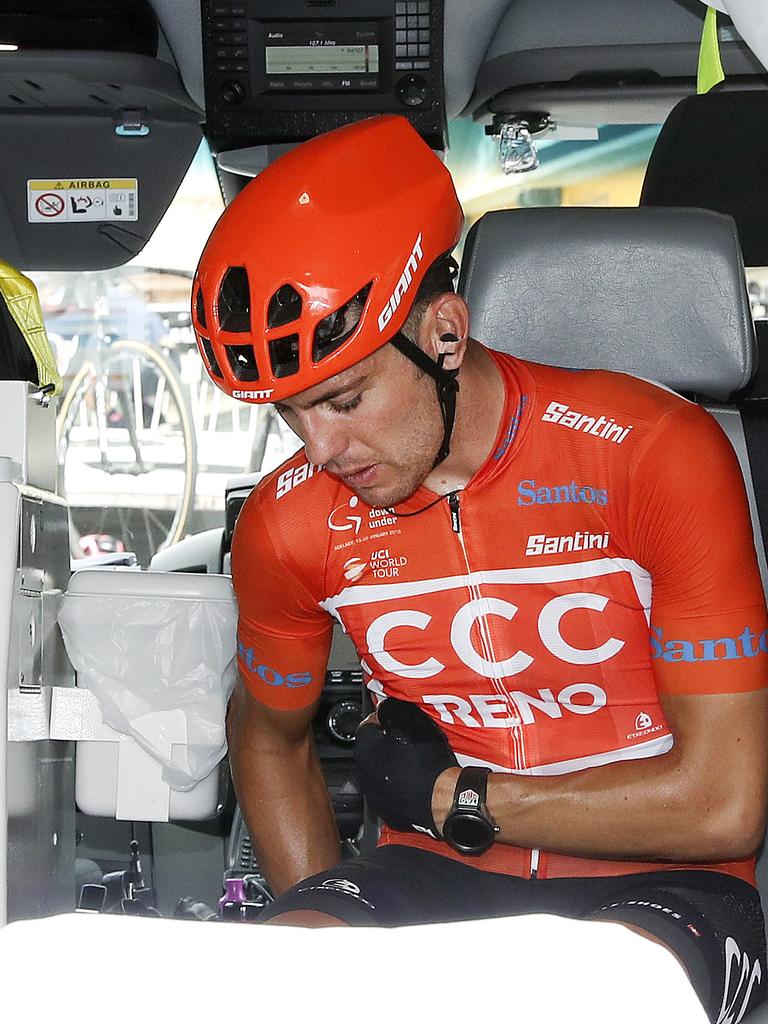 Patrick Bevin sits in an ambulance after reaching the line. Picture Sarah Reed