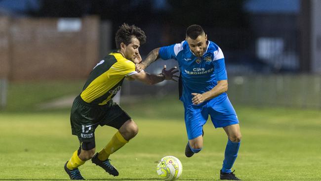 Mitchelton player Sebastian Kaye (left) looks to shut down SWQ Thunder midfielder Pasquale De Vita. Picture: Kevin Farmer