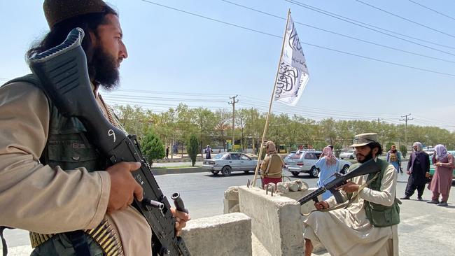 Taliban fighters stand guard outside the Interior Ministry in Kabul. Picture: AFP