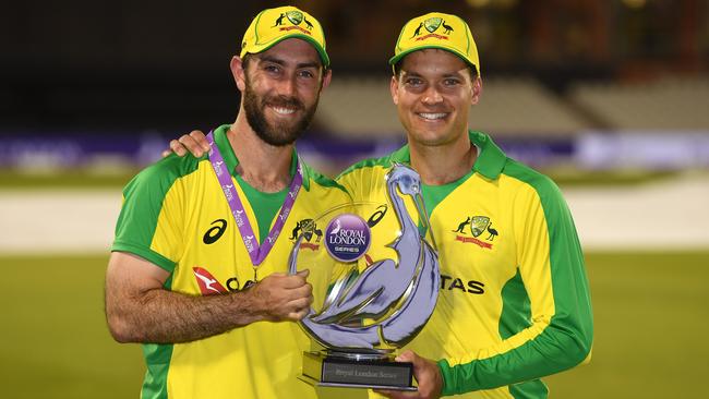 Glenn Maxwell and Alex Carey pose with the Royal London One Day Series trophy after guiding Australia to victory over England at Old Trafford in Manchester this morning (AEST). Picture: Getty Images