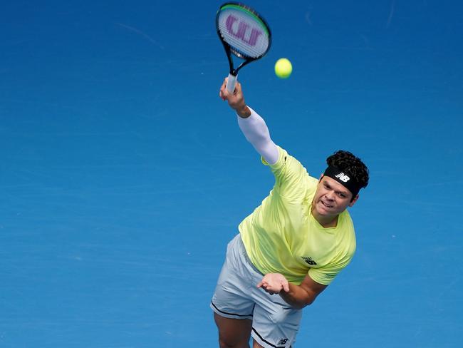 Milos Raonic of Canada serves during his fourth round match against Marin Cilic of Croatia on day seven of the Australian Open tennis tournament at Margaret Court Arena in Melbourne, Sunday, January 26, 2020. (AAP Image/Michael Dodge) NO ARCHIVING, EDITORIAL USE ONLY