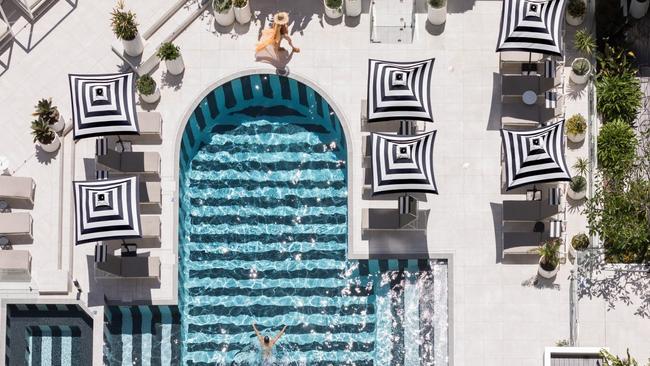 4. QT Gold CoastCertain hotels make you feel cool just by staying there. This is one of them.Why we love it: genuinely quirky, playful and with its own tequila bar, Stingray.What to consider: you will constantly be reaching for your camera to share details of this place on your socials.What features does QT Gold Coast have?A dazzling pool deck ringed by cabanas.Six bars and restaurants - with a moreishly modern twist on high tea.The ultra-bougie spa Q - try the Plush Princess with its therapeutic salt scrub, massage and gua sha facial massage ($385)What to know: The recently introduced Cabins are standalone surf shack style digs are one of the most innovative hotel projects we've seen in ages. Comfy, cosy and elegant.Book at Escape Deals Click here for more great hotels on the Gold Coast