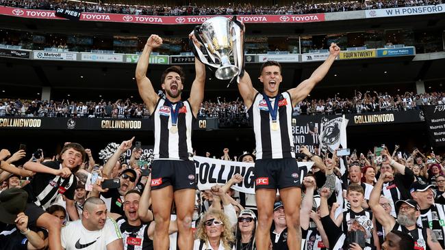 Josh and Nick Daicos of the Magpies on top of the world with the Pies’ faithful. Can they mount the summit again in 2024? Picture: Michael Klein