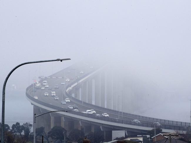 Fog over Tasman Bridge. Picture: Chris Kidd