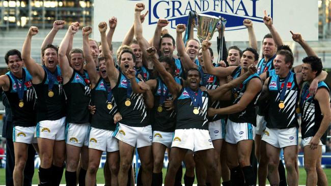 Port Adelaide celebrate their 2004 premiership win at the MCG.