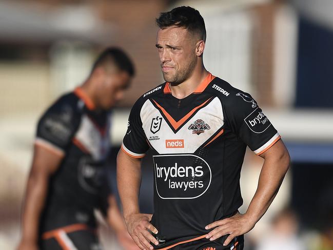 ROCKHAMPTON, AUSTRALIA - AUGUST 21:  Luke Brooks of the Tigers looks dejected after losing the round 23 NRL match between the Wests Tigers and the Cronulla Sharks at Browne Park, on August 21, 2021, in Rockhampton, Australia. (Photo by Ian Hitchcock/Getty Images)