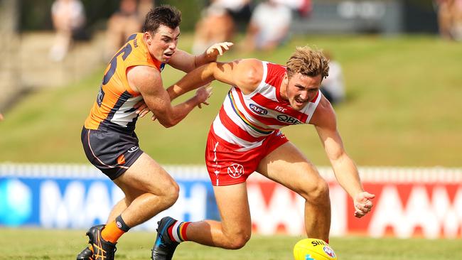 Will Gould of the Swans competeS for the ball