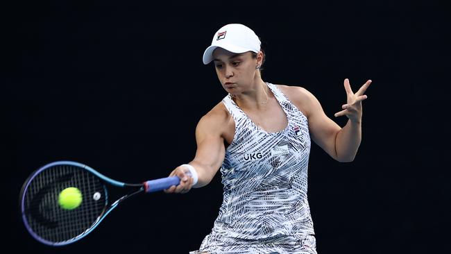 MELBOURNE, AUSTRALIA – JANUARY 17: Ashleigh Barty of Australia plays a forehand in her first round singles match against Lesia Tsurenko of Ukraine during day one of the 2022 Australian Open at Melbourne Park on January 17, 2022 in Melbourne, Australia. (Photo by Cameron Spencer/Getty Images)