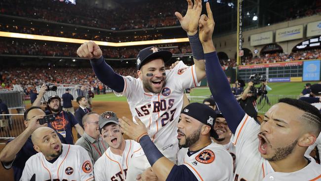 The Houston Astros celebrate winning Game 7 of baseball's American League Championship Series against the New York Yankees.