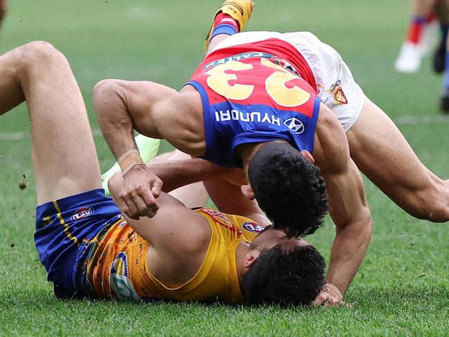 PERTH, AUSTRALIA - JULY 14: Liam Duggan of the Eagles is tackled by Charlie Cameron of the Lions during the 2024 AFL Round 18 match between the West Coast Eagles and the Brisbane Lions at Optus Stadium on July 14, 2024 in Perth, Australia. (Photo by Will Russell/AFL Photos via Getty Images)