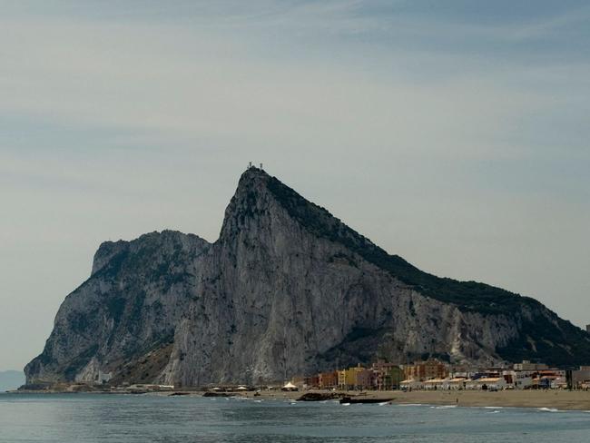 (FILES) This file photo taken on May 25, 2012 from La Linea de la Concepcion, near Cadiz, shows the Rock of the British colony of Gibraltar. Madrid and London on April 3, 2017 are once again locking horns over Gibraltar, a tiny, rocky British overseas territory that appears to have become a weapon for Spain and the European Union in complicated Brexit negotiations. / AFP PHOTO / Jorge Guerrero