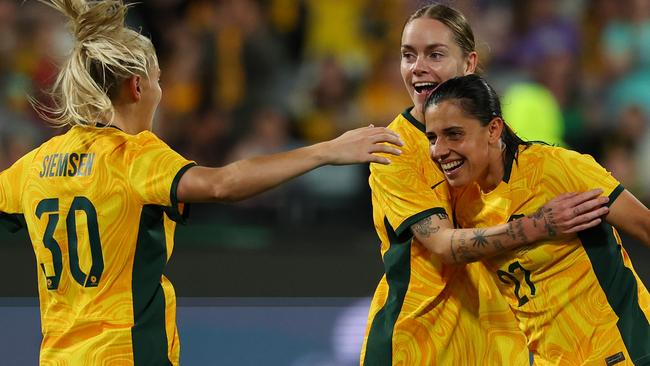 GEELONG, AUSTRALIA - DECEMBER 07: Sharn Freier of Australia celebrates scoring a goal with Alex Chidiac and Remy Siemsen of Australia during the International Friendly Match between the Australia Matildas and Chinese Taipei at GMHBA Stadium on December 07, 2024 in Geelong, Australia. (Photo by Morgan Hancock/Getty Images)