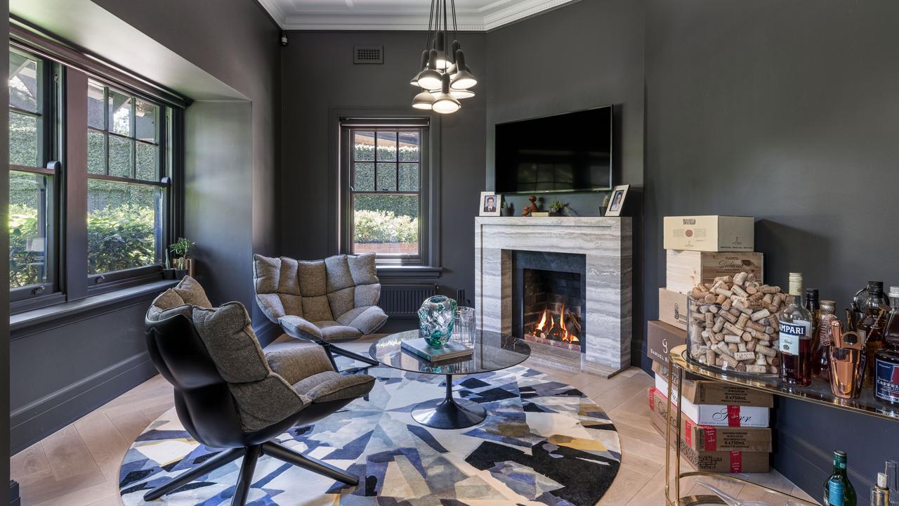 Another fireplace and TV in the bar area.