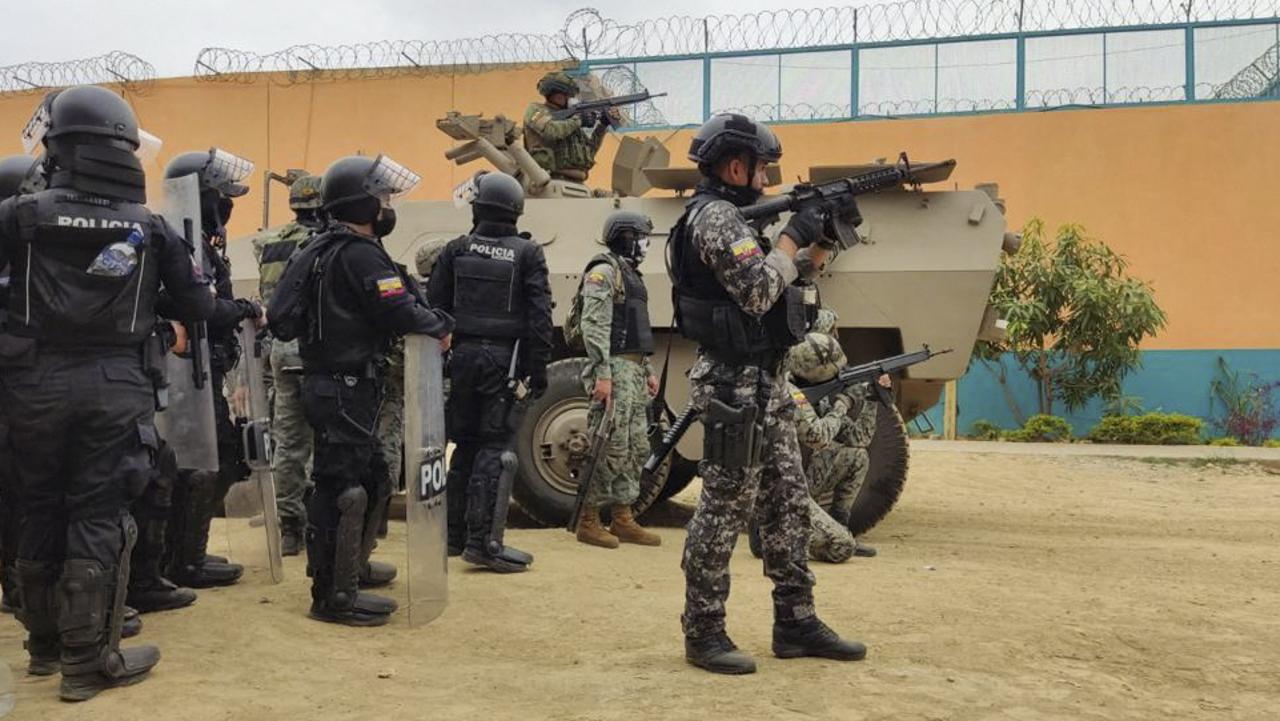 Members of the National Police and the Army carry out an operation inside the Litoral penitentiary in Guayaquil, Ecuador. (Photo by Ecuador's Presidency press office / AFP)