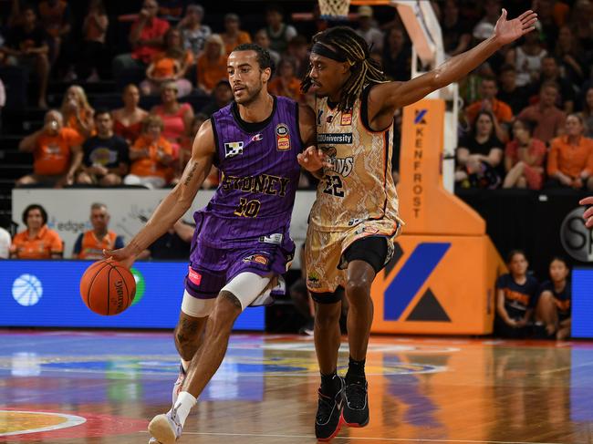 McCall (R) made it clear defensive stops was going to be key to the Taipans overcoming the Kings. Picture: Emily Barker/Getty Images