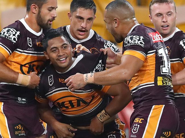 BRISBANE, AUSTRALIA - MARCH 20: Anthony Milford of the Broncos (centre) celebrates a try with team mates during the round 2 NRL match between the Brisbane Broncos and the South Sydney Rabbitohs at Suncorp Stadium on March 20, 2020 in Brisbane, Australia. (Photo by Jono Searle/Getty Images)