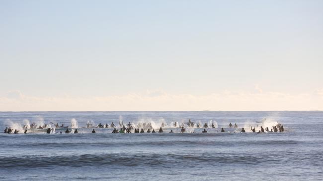 Members of the public took part in a paddle-out at Byron Bay's Main Beach to protest against the planned Netflix reality show Byron Baes on the morning of Tuesday, April 20, 2021. Picture: Liana Boss