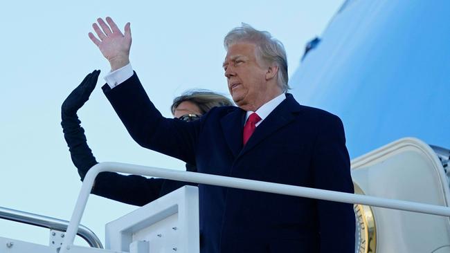 US President Donald Trump and Melania Trump wave as they board Air Force One en route to Florida. Picture: AFP