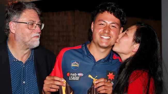 MELBOURNE, AUSTRALIA - DECEMBER 09: Connor Downie celebrates with his parents after his name is read out during the NAB AFL Draft on December 09, 2020 in Melbourne, Australia. (Photo by Michael Willson/AFL Photos via Getty Images)