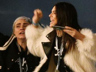 Kendall Jenner (right) and Cara Delevingne watching Kanye West performing on The Pyramid Stage at the Glastonbury Festival, at Worthy Farm in Somerset.. Picture date: Saturday June 27, 2015. Photo credit should read: Yui Mok/PA Wire