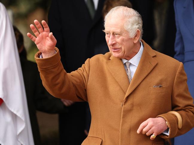 TOPSHOT - Britain's King Charles III waves to well-wishers after attending the Royal Family's traditional Christmas Day service at St Mary Magdalene Church on the Sandringham Estate in eastern England, on December 25, 2023. (Photo by Adrian DENNIS / AFP)