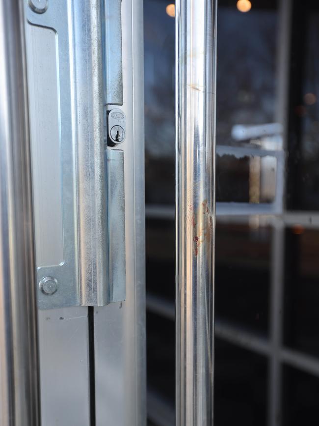 Bloodstains on door handles at the Midway Tavern. Picture: Russell Millard