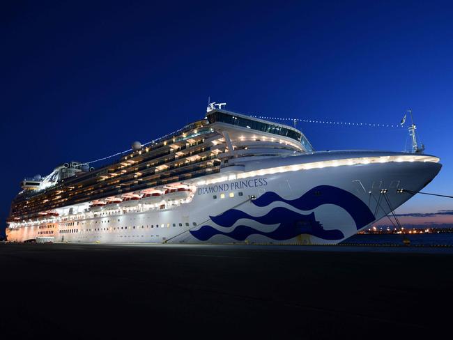 TOPSHOT - The Diamond Princess cruise ship, with over 3,700 people quarantined onboard due to fears of the new coronavirus, is seen anchored at the Daikoku Pier Cruise Terminal in Yokohama port on February 6, 2020. - Thousands of people were stranded aboard two cruise ships in Asia on February 6, quarantined by officials desperate to stem the spread of a deadly virus that has killed hundreds in China and spread panic worldwide. (Photo by Kazuhiro NOGI / AFP)