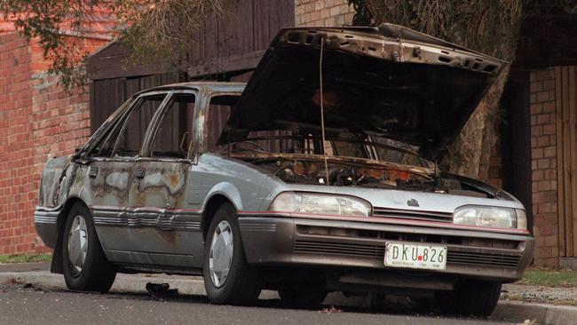 The alleged gunman's car found burnt-out approximately three blocks from murder scene.