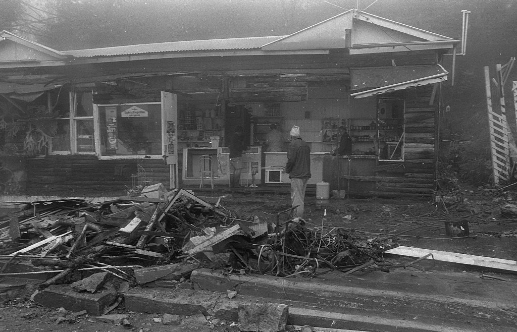 Historic: Toowoomba: Accidents: Clean up at the Log Cabin Service Station the morning after a semi-trailer rolled and crashed in the building removing most of the front of the station. The owner in 1978, Mr Neville Hammond started rebuilding immediately. Photo: Bruce Mackenzie / The Chronicle Neg: U875. Picture: Bruce Mackenzie