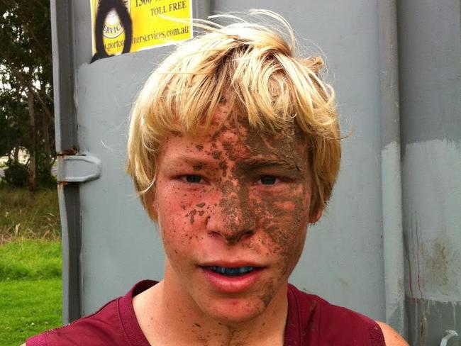 A young Isaac Heeney covered in mud after playing a game for his junior club, the Cardiff Hawks. Photo: Supplied.