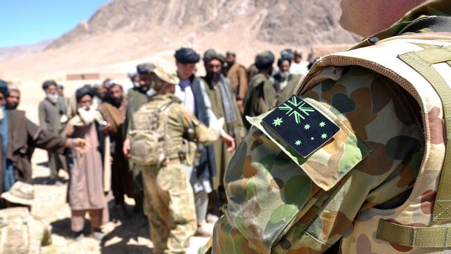 Special Operations Task Group welcome local Afghan government officials to a 'shura' (town meeting) to discuss security in the Gizab area of Uruzgan province, southern Afghanistan. Picture: Department of Defence