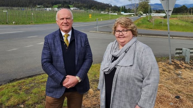 Transport Minister Eric Abetz and Huon Valley Council Mayor Sally Doyle pictured in front of the Huon Highway-Mountain River Road intersection in October last year. Picture: Huon Valley Council