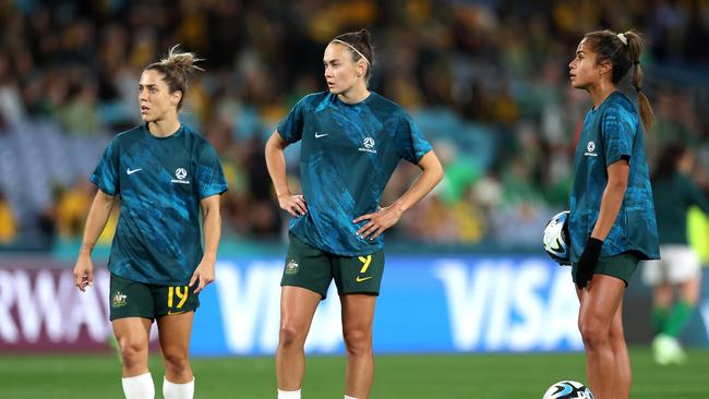 Katrina Gorry, Caitlin Foord and Mary Fowler warm up prior to their World Cup opener. Picture: Getty