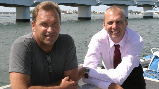 Then-Councillor Grant Pforr and Roland Brautigam from Solar Coast Cats at a ferry terminal at Paradise Point.