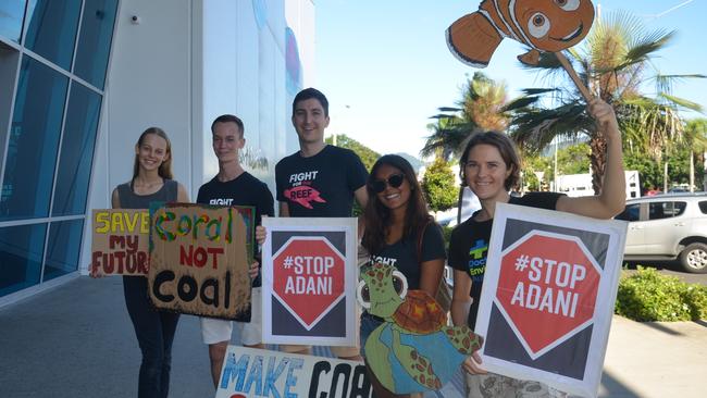 Stop Adani protesters (from left) Clare Galvin, Garrett Swearingen, Australian Marine Conservation Society’s David Cazzulino, Nicole Senn and Bec Tuma await Opposition Leader Bill Shorten's arrival at the Cairns Aquarium. PICTURE: CHRIS CALCINO