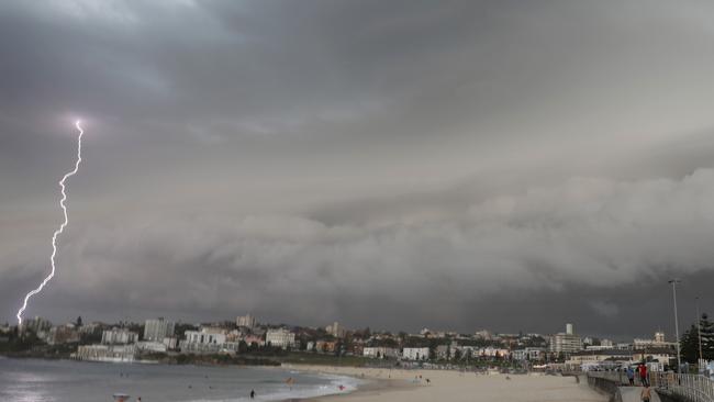 A lightning bolt strikes as a storm cell rolls over Bondi Beach on Saturday. Picture: AAP Image/Chris Pavlich