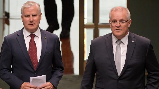 Prime Minister Scott Morrison arrives with Deputy Prime Minister Michael McCormack to deliver a condolence motion in the House of Representatives yesterday. Picture: AAP