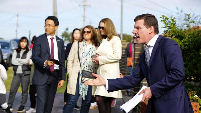 Suburbs in Sydney’s Ryde region have seen the biggest gains in price since the COVID-19 pandemic. Pictured: Auctioneer Max Wylie during a Ryde home auction. Photo: Gaye Gerard