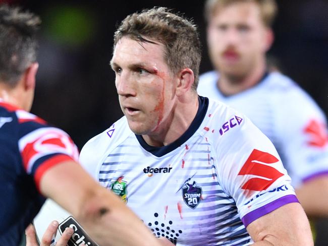 Ryan Hoffman of the Storm (right) runs into Cooper Cronk of the Roosters during the Round 16 NRL match between the Sydney Roosters and the Melbourne Storm at Adelaide Oval in Adelaide, Friday, June 29, 2018. (AAP Image/David Mariuz) NO ARCHIVING, EDITORIAL USE ONLY