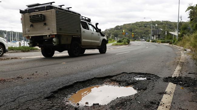 A pothole on McCarrs Creek Rd at Church Point. Northern Beaches Council has offered to fix roads managed by the NSW Government — then send it the bill. Picture: Tim Hunter.