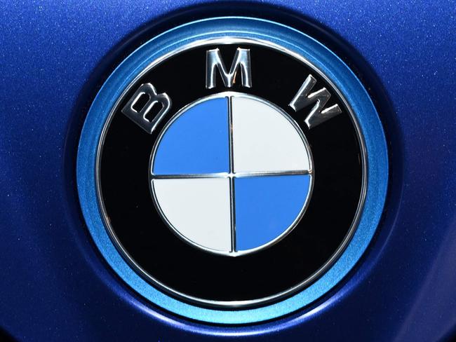(FILES) The logo of German carmaker BMW can be seen on a car at the International Motor Show (IAA) Germany, on September 8, 2021 in Munich, southern Germany. BMW said on September 10, 2024 it was recalling about 1.5 million vehicles due to problems with their brakes, prompting the German luxury carmaker to cut its outlook for the year. The auto giant said vehicle deliveries in 2024 would now come in slightly lower than the previous year, after having earlier expected an increase. It also lowered its guidance for profitability.Â  (Photo by Christof STACHE / AFP)