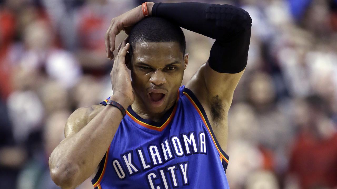 Oklahoma City Thunder guard Russell Westbrook walks down court with only seconds to go during the second half of an NBA basketball game against the Portland Trail Blazers in Portland, Ore., Friday, Feb. 27, 2015. Westbrook scored 40 points but missed an opportunity to tie the game, making only two of three free throws with just seconds left. Portland won 115-112. (AP Photo/Don Ryan)