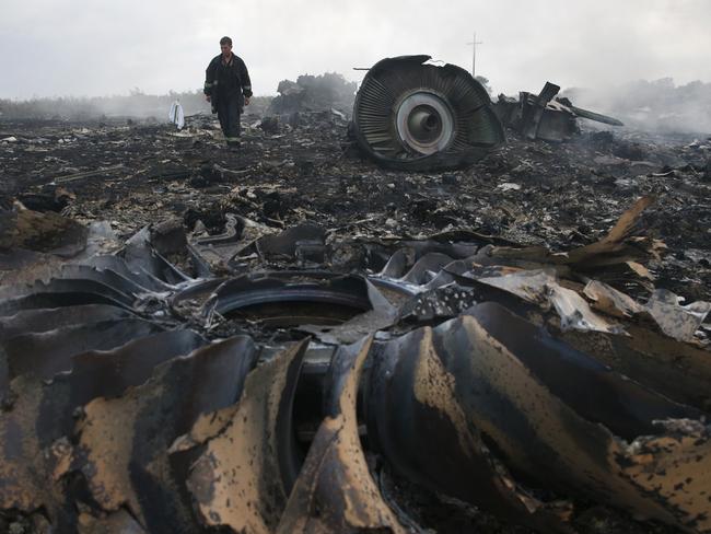 An Emergencies Ministry member walks at a site of a Malaysia Airlines Boeing 777 plane crash near the settlement of Grabovo in the Donetsk. Picture: Reuters