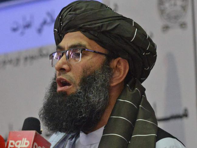 Taliban minister for Promotion of Virtue and Prevention of Vice Mohammad Khalid Hanafi speaks during a ceremony to announce the decree for Afghan women's dress code in Kabul on May 7, 2022. - The Taliban on May 7 imposed some of the harshest restrictions on Afghanistan's women since they seized power, ordering them to cover fully in public, ideally with the traditional burqa. (Photo by Ahmad SAHEL ARMAN / AFP)