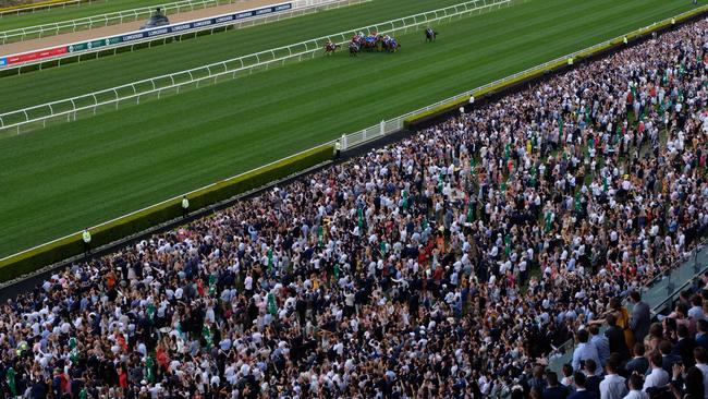 The crowd at Royal Randwick watches Nature Strip power home to win The Everest last year.