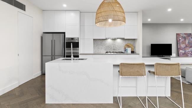 Herringbone oak floors add a warm note to the kitchen.