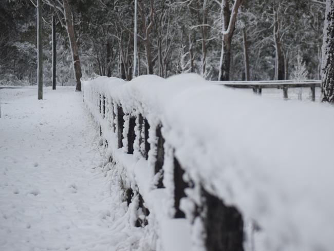 POWDER: Snow completely covered the front fence of this property at Storm King, near Stanthorpe.  Photo: Alex Nolan / Stanthorpe Border Post